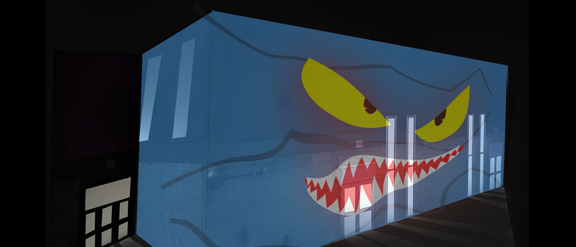 The final projection features a fluid blue animation that gradually fills and transforms the building’s surface, culminating in the subtle reveal of glowing eyes and a mouth to create a dynamic, living facade effect.